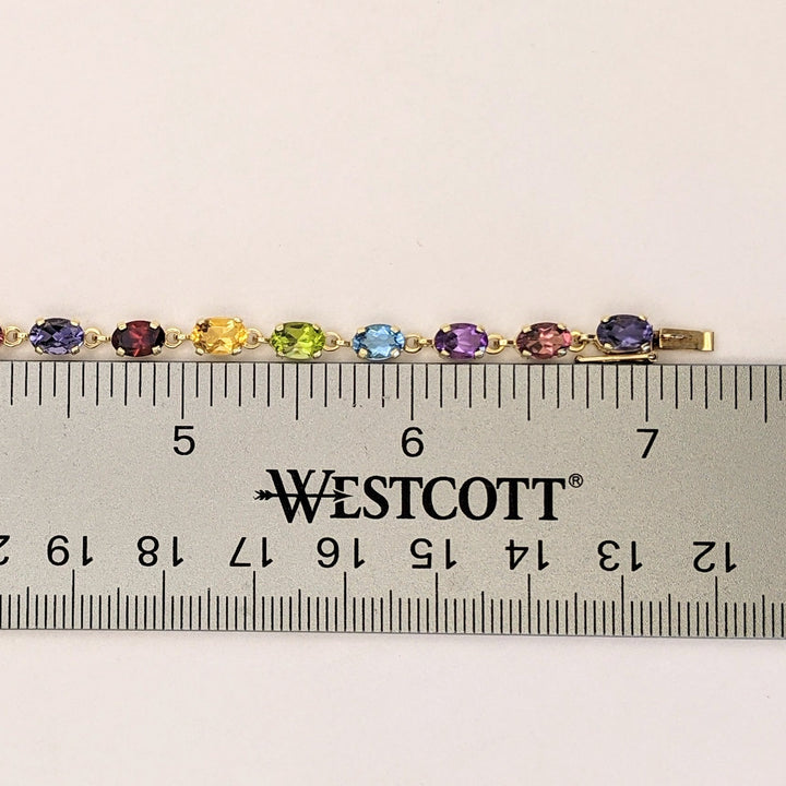 14K IOLITE, TOURMALINE, AMETHYST, BLUE TOPAZ, PERIDOT, CITRINE, GARNET OVAL 4X6 ESTATE BRACELET 6.7 GRAMS