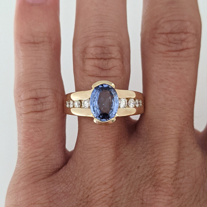 14K SAPPHIRE OVAL 7X9 WITH .59 DIAMOND TOTAL WEIGHT (24) ROUND ESTATE RING 8.1 GRAMS