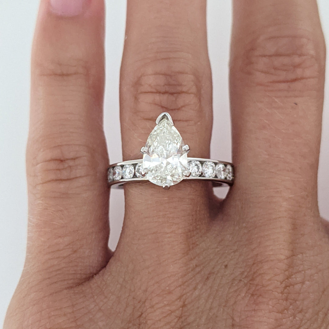 14K WHITE 2.39 CARAT TOTAL WEIGHT I1 K DIAMOND PEAR WITH (10) ROUND CHANNEL DIAMOND ESTATE RING 4.1 GRAMS