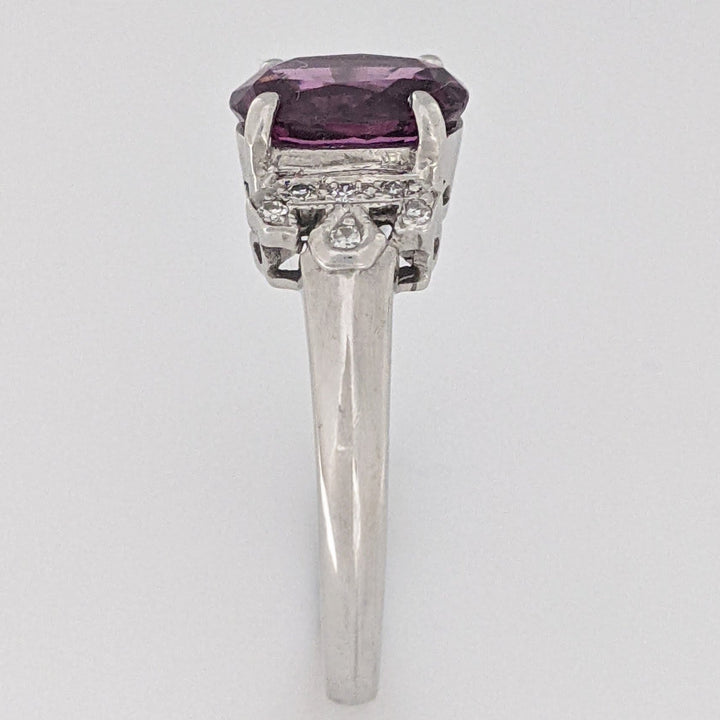 18K WHITE RHODOLITE GARNET OVAL 7X8.5 WITH .06 DIAMOND TOTAL WEIGHT ESTATE RING 3.8 GRAMS