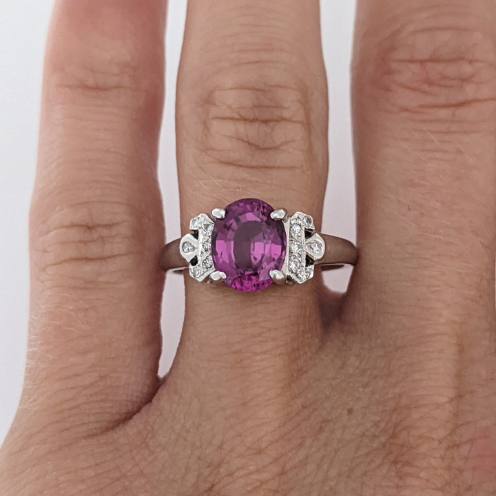 18K WHITE RHODOLITE GARNET OVAL 7X8.5 WITH .06 DIAMOND TOTAL WEIGHT ESTATE RING 3.8 GRAMS