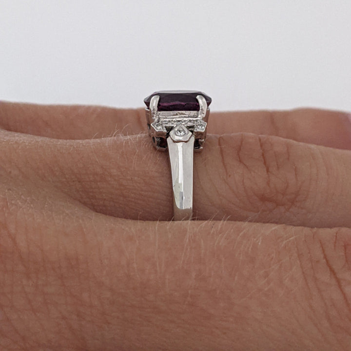 18K WHITE RHODOLITE GARNET OVAL 7X8.5 WITH .06 DIAMOND TOTAL WEIGHT ESTATE RING 3.8 GRAMS