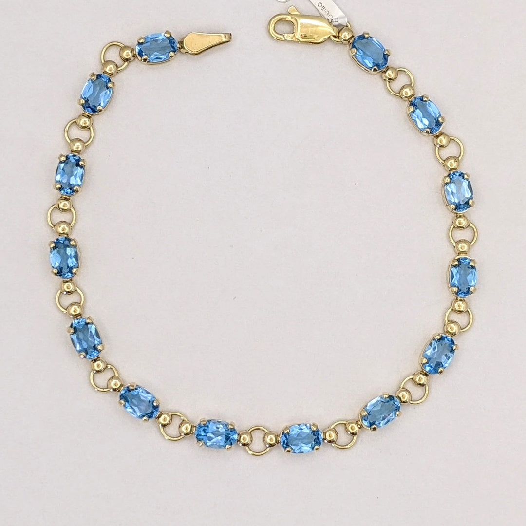 10K BLUE TOPAZ OVAL 4X6 (14) ESTATE BRACELET 5.4 GRAMS