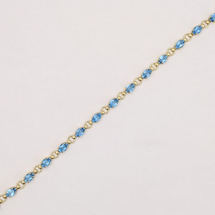 10K BLUE TOPAZ OVAL 4X6 (14) ESTATE BRACELET 5.4 GRAMS