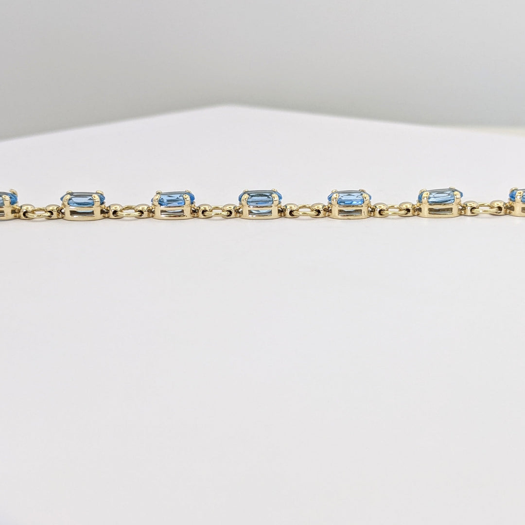 10K BLUE TOPAZ OVAL 4X6 (14) ESTATE BRACELET 5.4 GRAMS