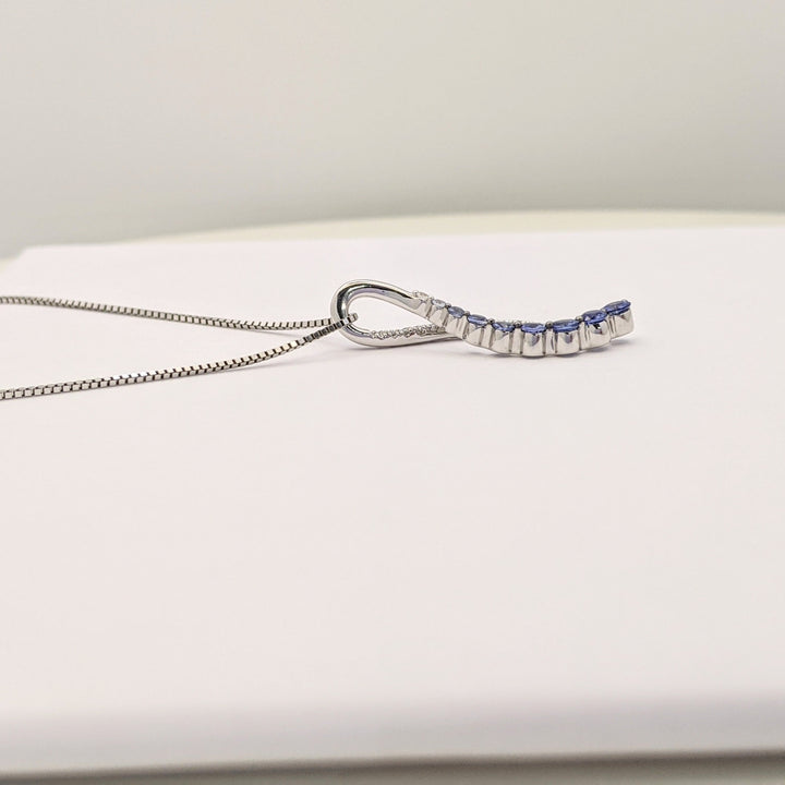 14K WHITE SAPPHIRE (9) ROUND WHITE/BLUE WITH .20 DIAMOND TOTAL WEIGHT RIBBON ESTATE PENDANT &amp; CHAIN 5.0 GRAMS