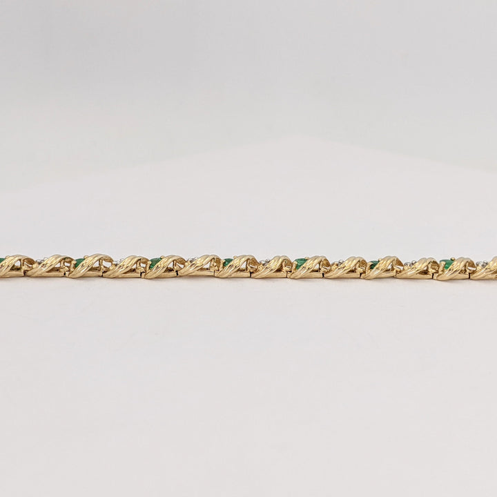 10K EMERALD ROUND (16) 2.5MM WITH .08 DIAMOND TOTAL WEIGHT (16) ROUND ESTATE BRACELET 6.0 GRAMS