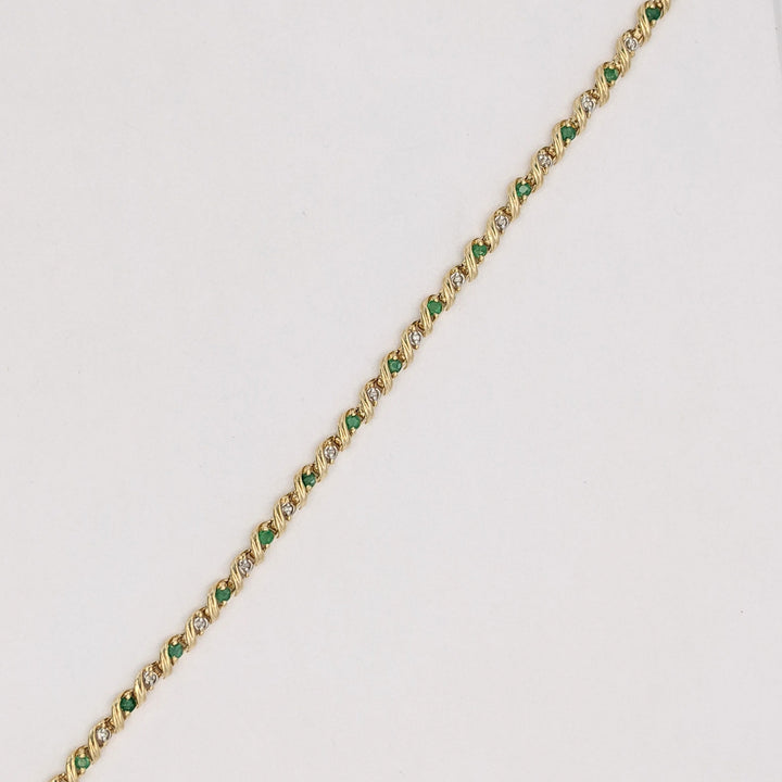 10K EMERALD ROUND (16) 2.5MM WITH .08 DIAMOND TOTAL WEIGHT (16) ROUND ESTATE BRACELET 6.0 GRAMS