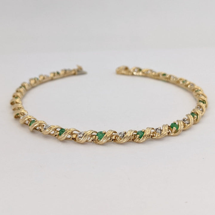 10K EMERALD ROUND (16) 2.5MM WITH .08 DIAMOND TOTAL WEIGHT (16) ROUND ESTATE BRACELET 6.0 GRAMS