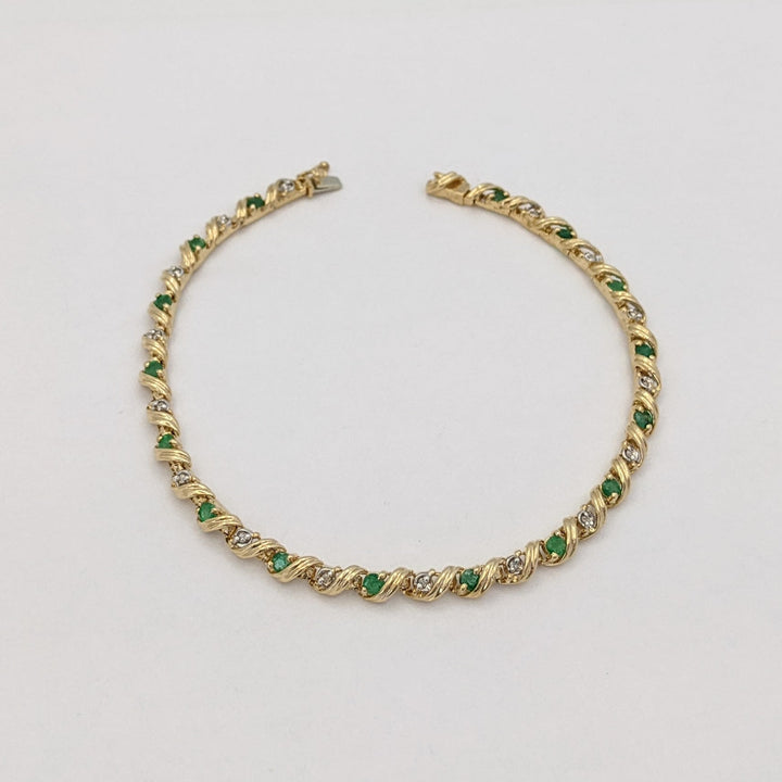 10K EMERALD ROUND (16) 2.5MM WITH .08 DIAMOND TOTAL WEIGHT (16) ROUND ESTATE BRACELET 6.0 GRAMS