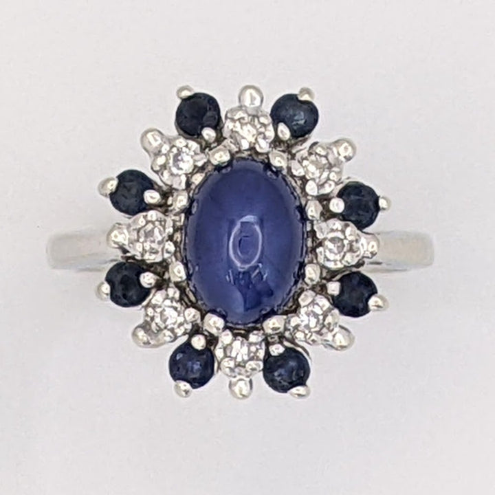 14K WHITE LAB-CREATED STAR SAPPHIRE OVAL WITH (8) 2.2MM SAPPHIRE ROUND AND .24 DIAMOND TOTAL WEIGHT (8) ROUND ESTATE RING 4.8 GRAMS