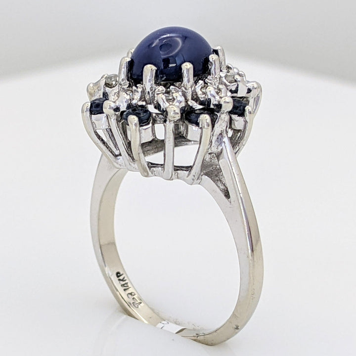14K WHITE LAB-CREATED STAR SAPPHIRE OVAL WITH (8) 2.2MM SAPPHIRE ROUND AND .24 DIAMOND TOTAL WEIGHT (8) ROUND ESTATE RING 4.8 GRAMS
