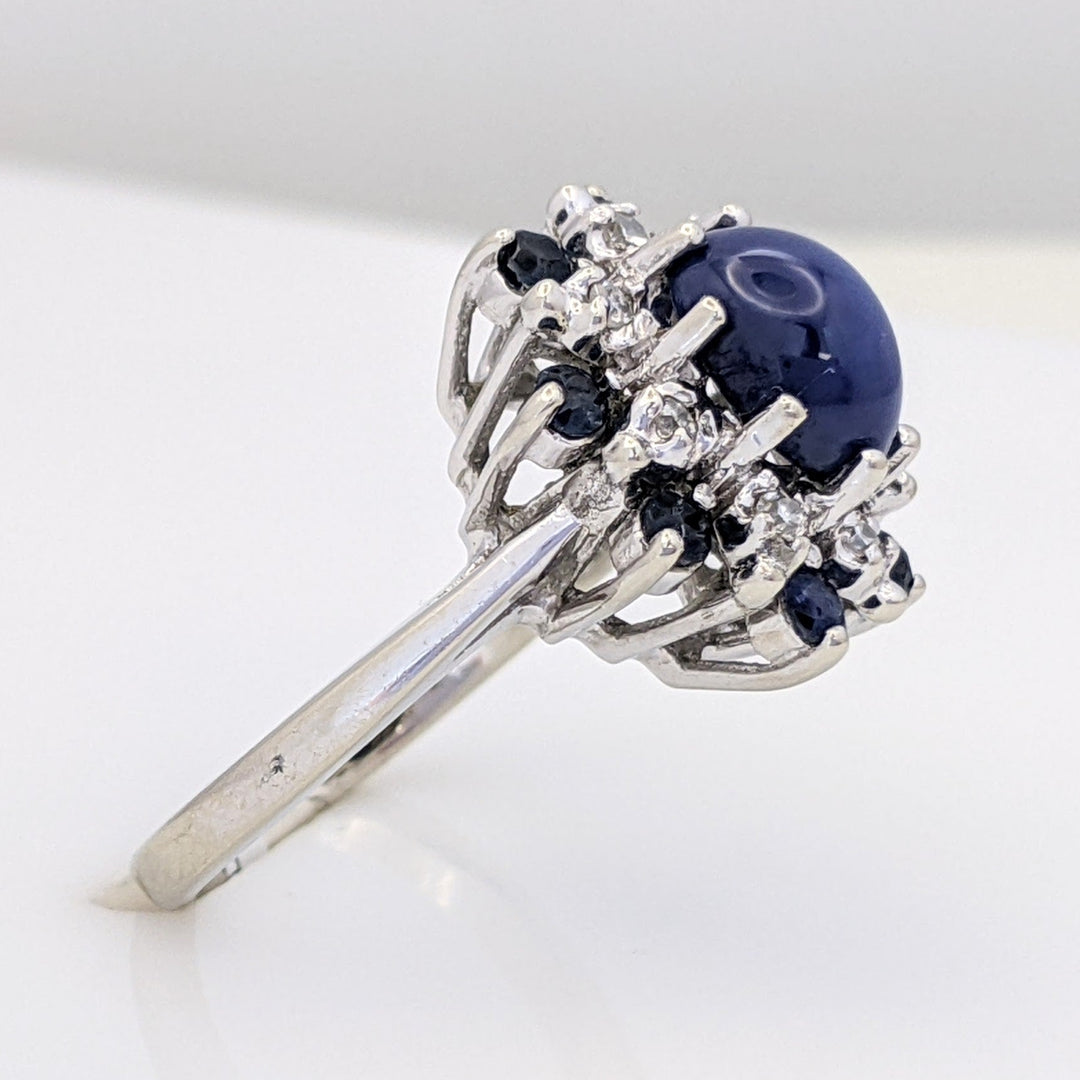 14K WHITE LAB-CREATED STAR SAPPHIRE OVAL WITH (8) 2.2MM SAPPHIRE ROUND AND .24 DIAMOND TOTAL WEIGHT (8) ROUND ESTATE RING 4.8 GRAMS