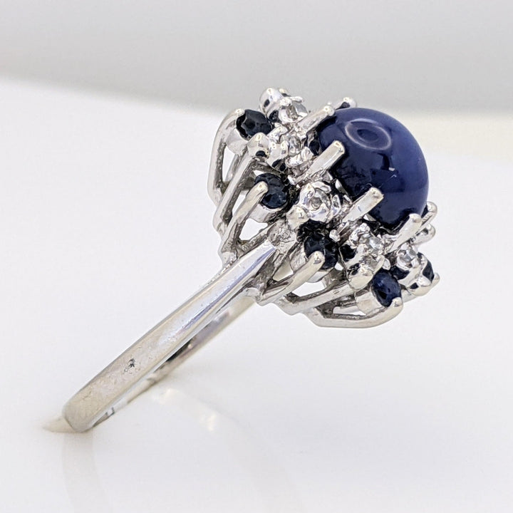 14K WHITE LAB-CREATED STAR SAPPHIRE OVAL WITH (8) 2.2MM SAPPHIRE ROUND AND .24 DIAMOND TOTAL WEIGHT (8) ROUND ESTATE RING 4.8 GRAMS