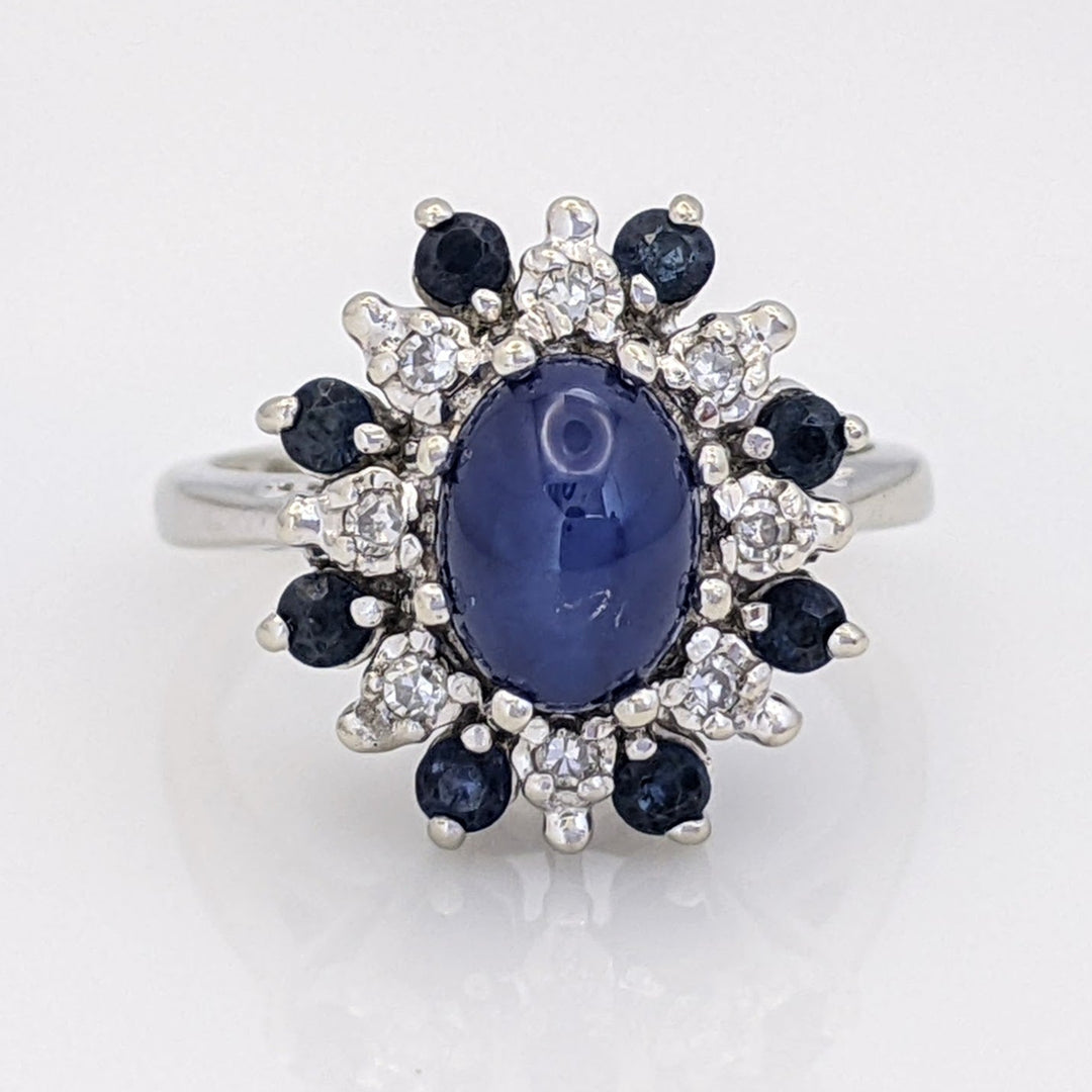 14K WHITE LAB-CREATED STAR SAPPHIRE OVAL WITH (8) 2.2MM SAPPHIRE ROUND AND .24 DIAMOND TOTAL WEIGHT (8) ROUND ESTATE RING 4.8 GRAMS