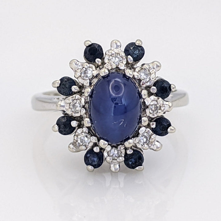 14K WHITE LAB-CREATED STAR SAPPHIRE OVAL WITH (8) 2.2MM SAPPHIRE ROUND AND .24 DIAMOND TOTAL WEIGHT (8) ROUND ESTATE RING 4.8 GRAMS