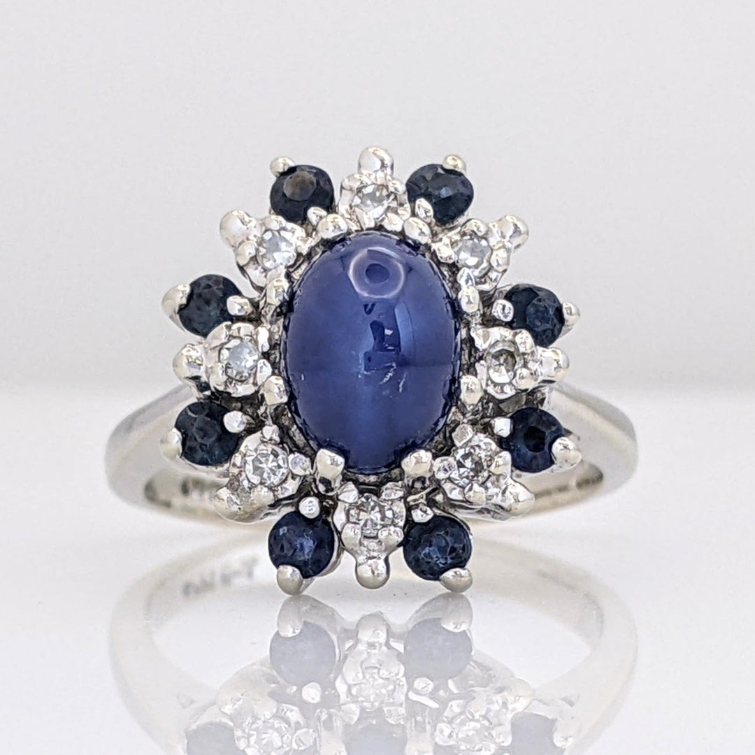 14K WHITE LAB-CREATED STAR SAPPHIRE OVAL WITH (8) 2.2MM SAPPHIRE ROUND AND .24 DIAMOND TOTAL WEIGHT (8) ROUND ESTATE RING 4.8 GRAMS