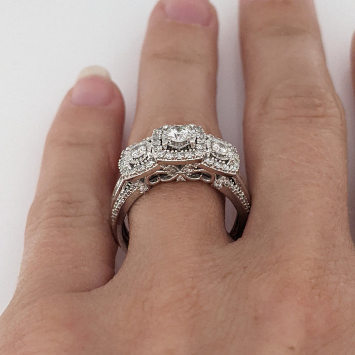10K WHITE .81 CARAT TOTAL WEIGHT I1 I DIAMOND ROUND (83) BAGUETTE (18) ESTATE HALO TRINITY RING 5.2 GRAMS