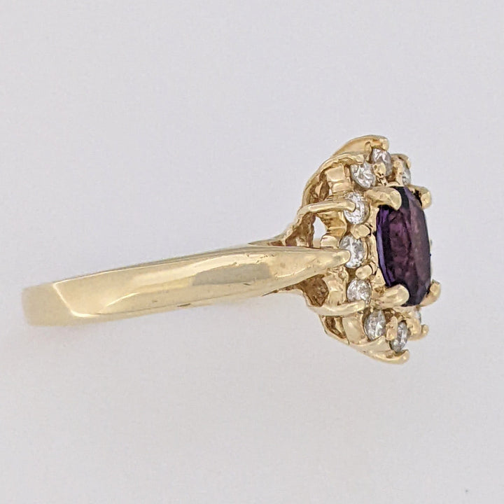 14K AMETHYST OVAL 5X7 WITH .24 DIAMOND TOTAL WEIGHT (12) ESTATE RING 4.6 GRAMS