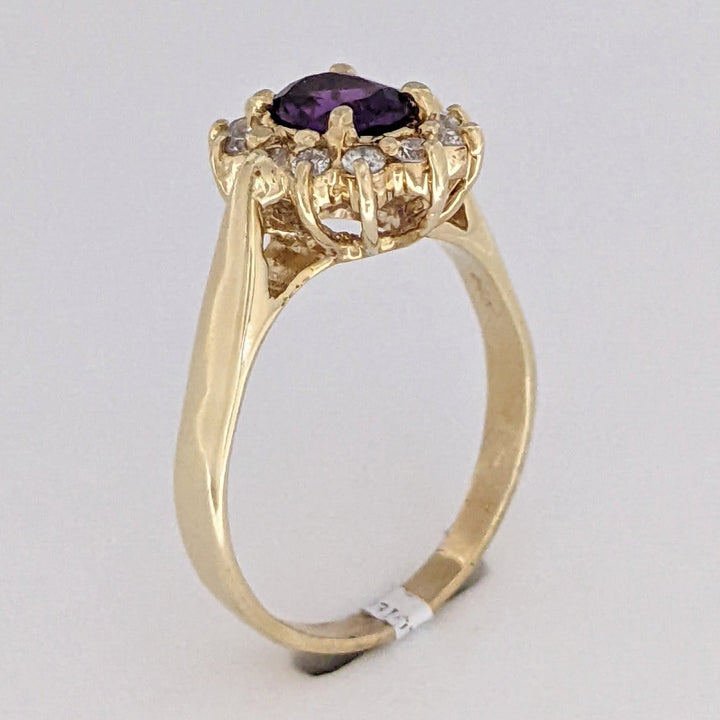 14K AMETHYST OVAL 5X7 WITH .24 DIAMOND TOTAL WEIGHT (12) ESTATE RING 4.6 GRAMS