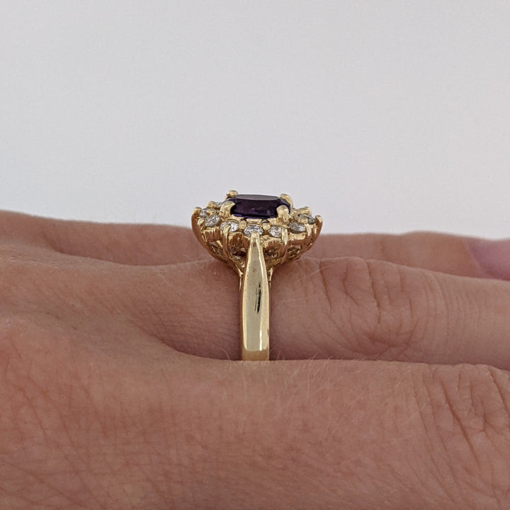 14K AMETHYST OVAL 5X7 WITH .24 DIAMOND TOTAL WEIGHT (12) ESTATE RING 4.6 GRAMS