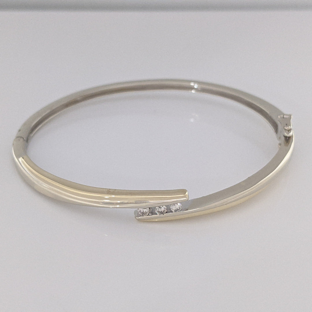 10K TWO-TONE .15 CARAT TOTAL WEIGHT SI2 K DIAMOND ROUND (3) BYPASS ESTATE BANGLE 14.5 GRAMS