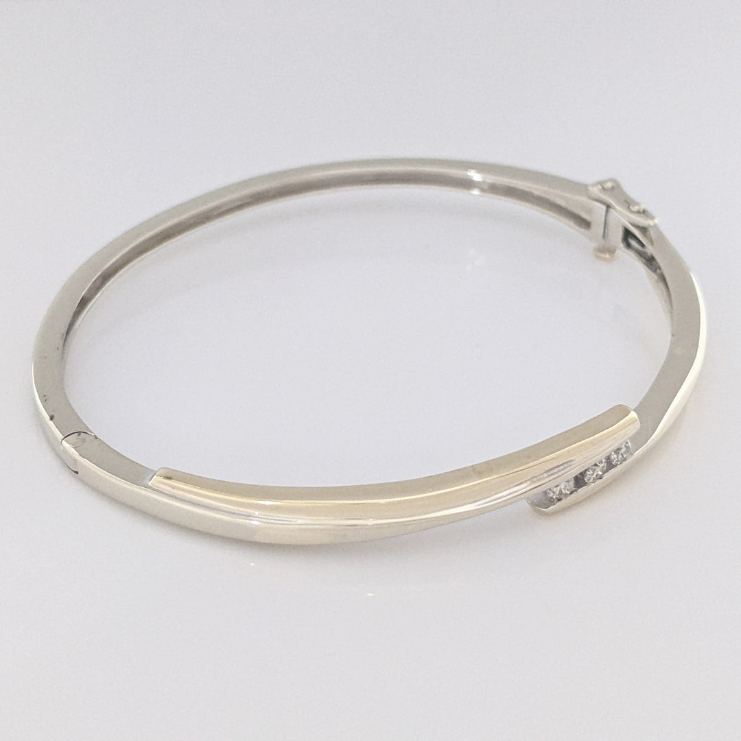 10K TWO-TONE .15 CARAT TOTAL WEIGHT SI2 K DIAMOND ROUND (3) BYPASS ESTATE BANGLE 14.5 GRAMS