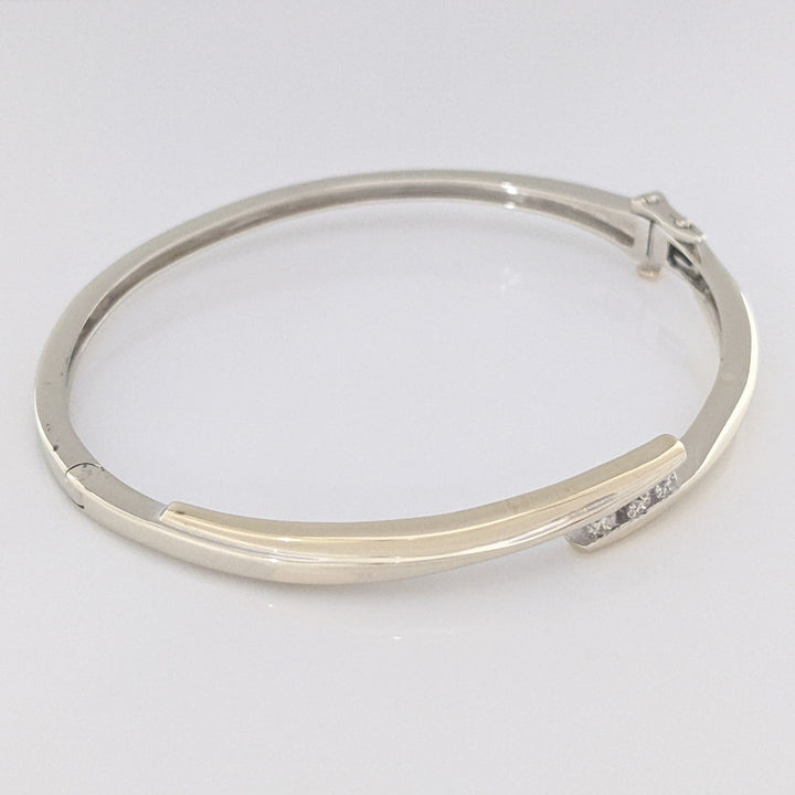 10K TWO-TONE .15 CARAT TOTAL WEIGHT SI2 K DIAMOND ROUND (3) BYPASS ESTATE BANGLE 14.5 GRAMS