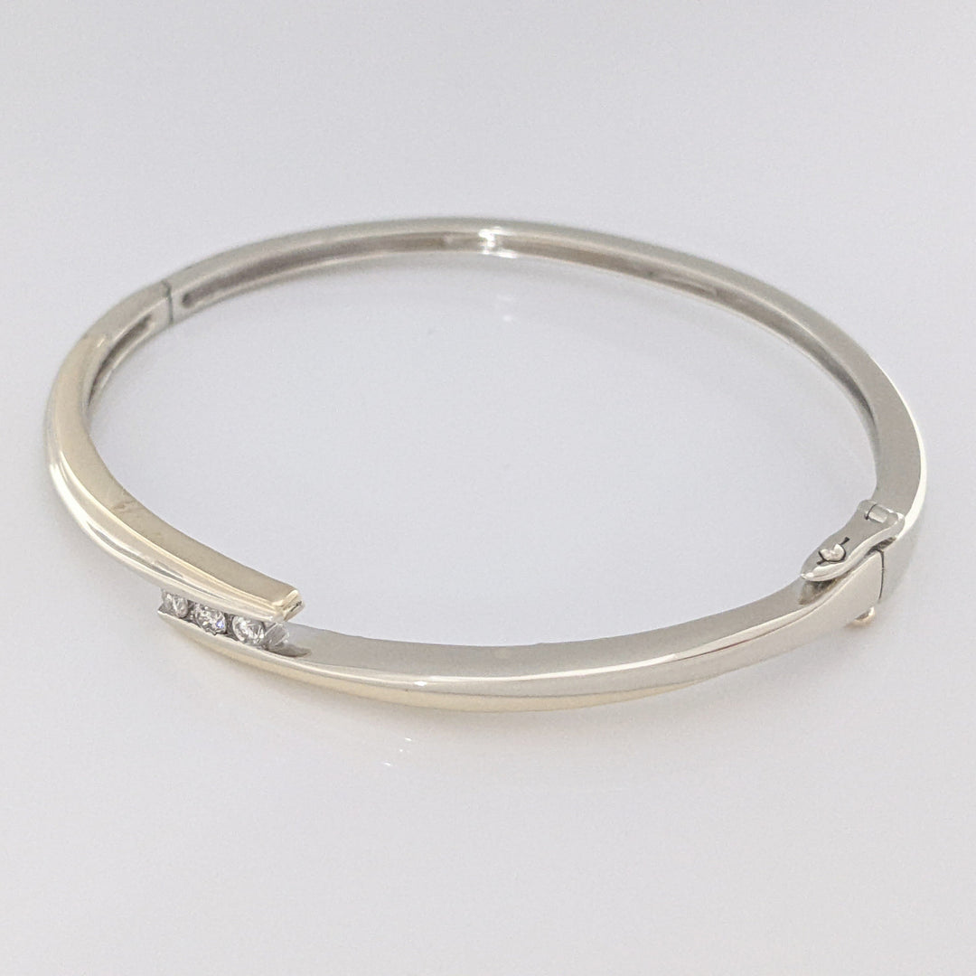 10K TWO-TONE .15 CARAT TOTAL WEIGHT SI2 K DIAMOND ROUND (3) BYPASS ESTATE BANGLE 14.5 GRAMS