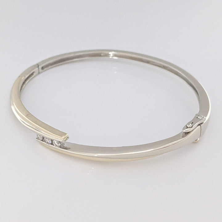 10K TWO-TONE .15 CARAT TOTAL WEIGHT SI2 K DIAMOND ROUND (3) BYPASS ESTATE BANGLE 14.5 GRAMS