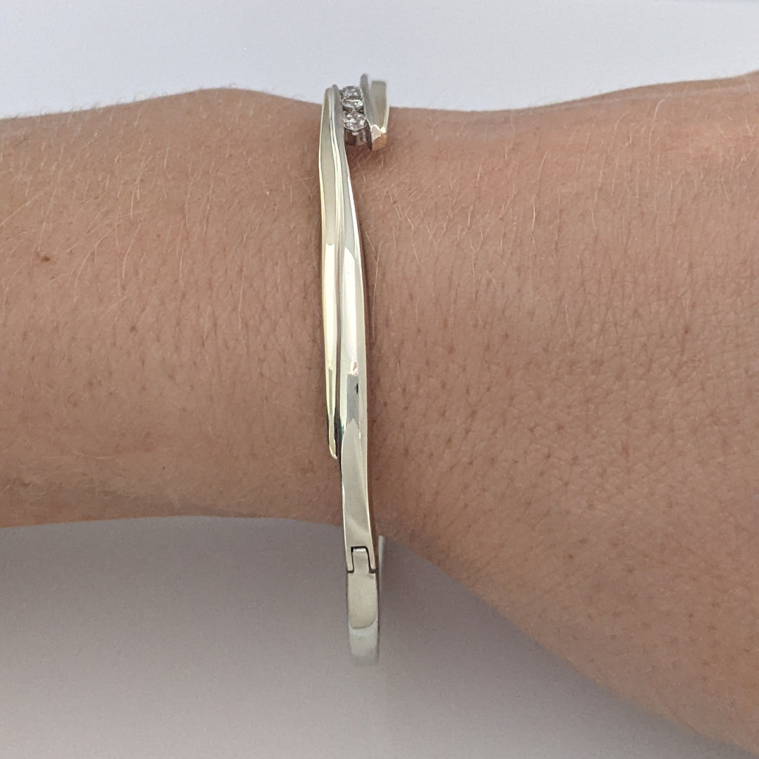 10K TWO-TONE .15 CARAT TOTAL WEIGHT SI2 K DIAMOND ROUND (3) BYPASS ESTATE BANGLE 14.5 GRAMS