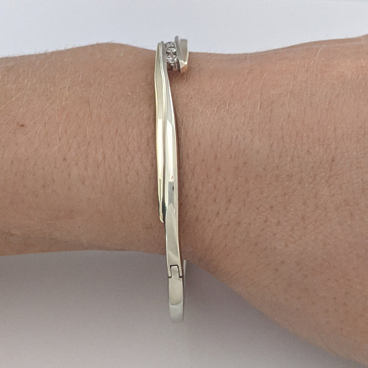 10K TWO-TONE .15 CARAT TOTAL WEIGHT SI2 K DIAMOND ROUND (3) BYPASS ESTATE BANGLE 14.5 GRAMS