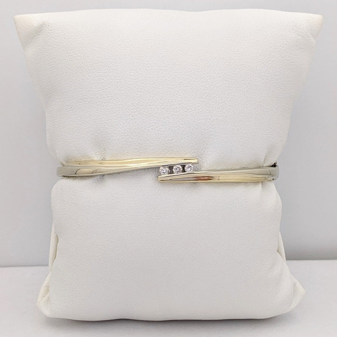 10K TWO-TONE .15 CARAT TOTAL WEIGHT SI2 K DIAMOND ROUND (3) BYPASS ESTATE BANGLE 14.5 GRAMS