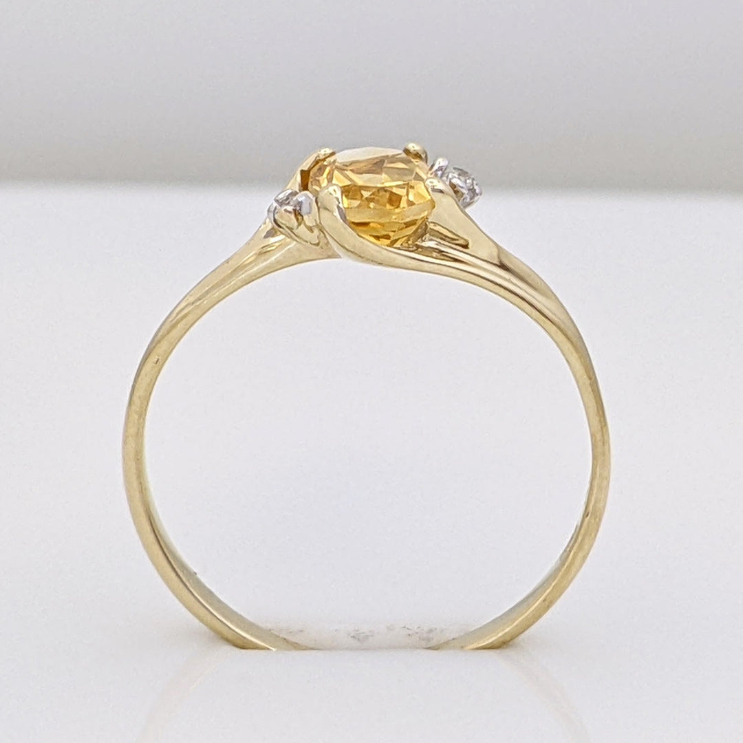 10K CITRINE OVAL 5X7 WITH (2) MELEE ESTATE RING 1.3 GRAMS