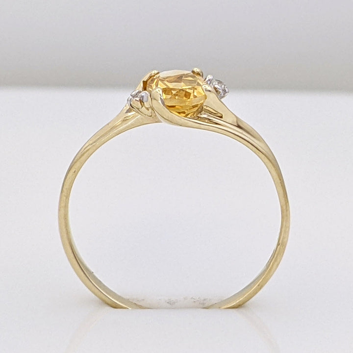 10K CITRINE OVAL 5X7 WITH (2) MELEE ESTATE RING 1.3 GRAMS