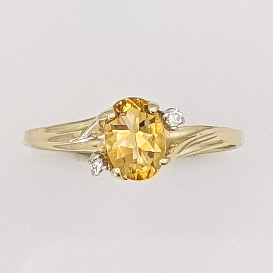 10K CITRINE OVAL 5X7 WITH (2) MELEE ESTATE RING 1.3 GRAMS