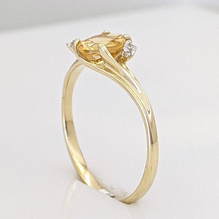 10K CITRINE OVAL 5X7 WITH (2) MELEE ESTATE RING 1.3 GRAMS