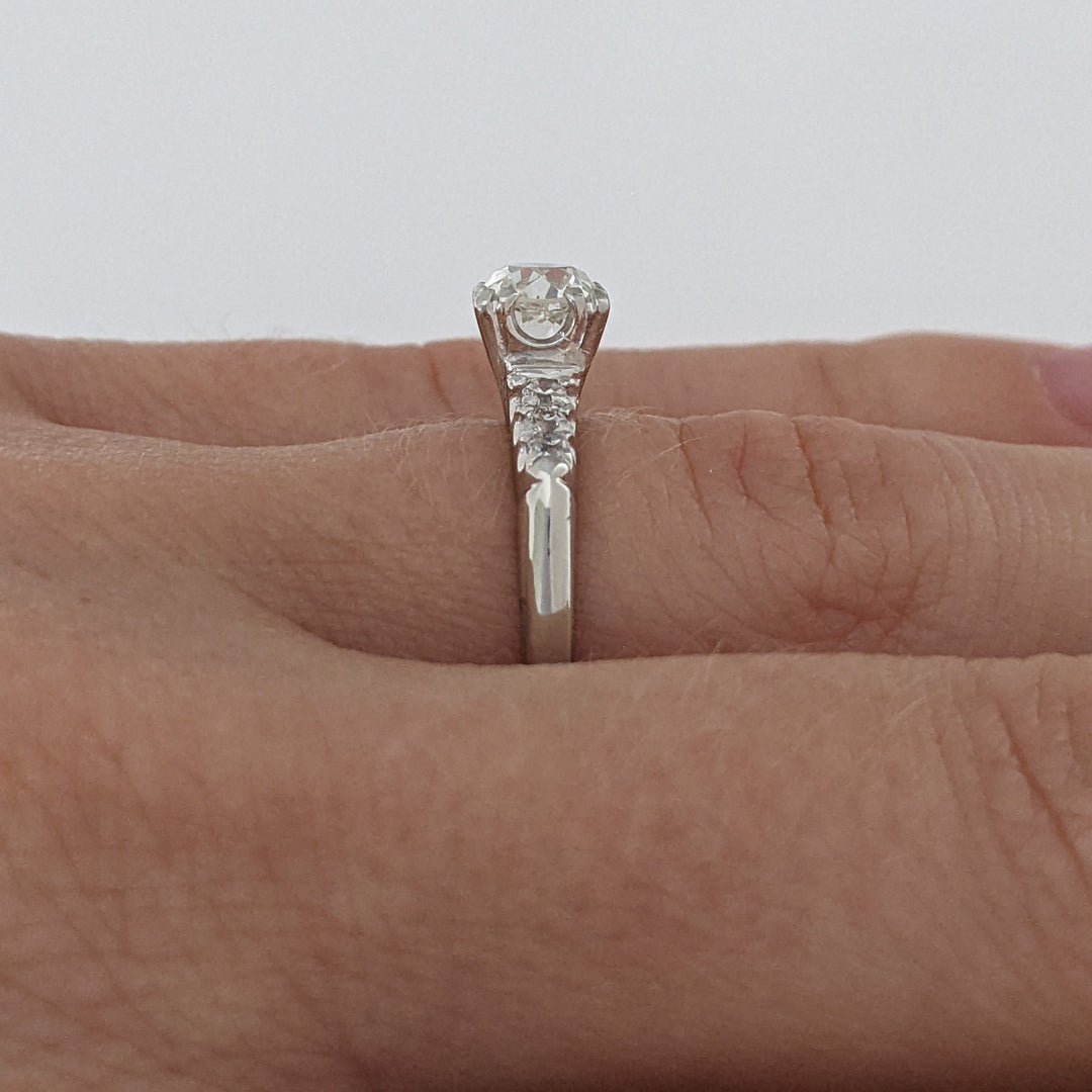 PLATINUM .72 CARAT TOTAL VS2 J DIAMOND ROUND WITH .12 DIAMOND TOTAL WEIGHT ESTATE RING 3.9 GRAMS