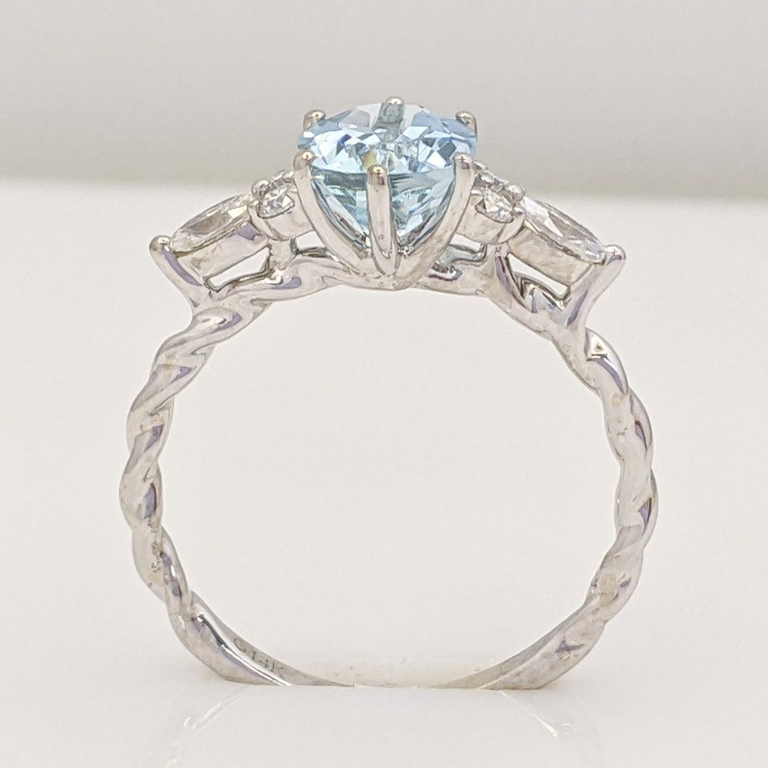 14K WHITE AQUAMARINE OVAL 6X9 WITH .24 DIAMOND TOTAL WEIGHT MARQUISE (2) ROUND (4) ESTATE RING 2.0 GRAMS