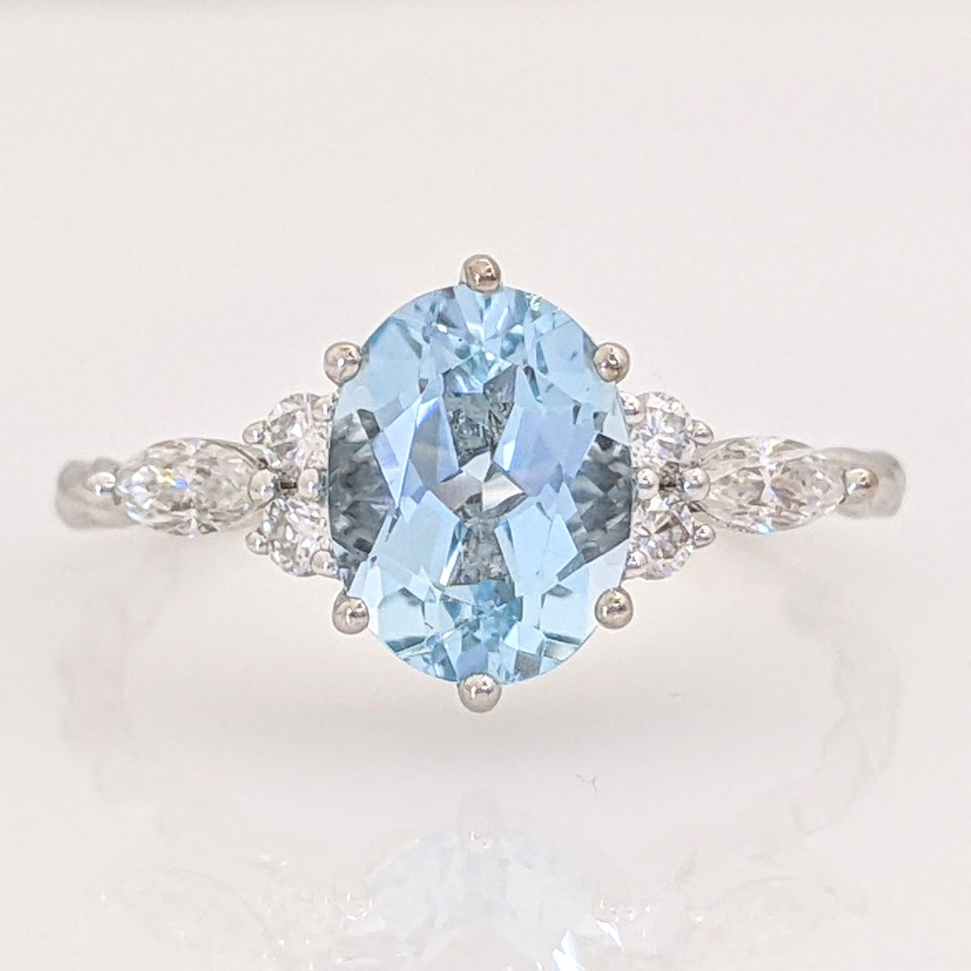 14K WHITE AQUAMARINE OVAL 6X9 WITH .24 DIAMOND TOTAL WEIGHT MARQUISE (2) ROUND (4) ESTATE RING 2.0 GRAMS