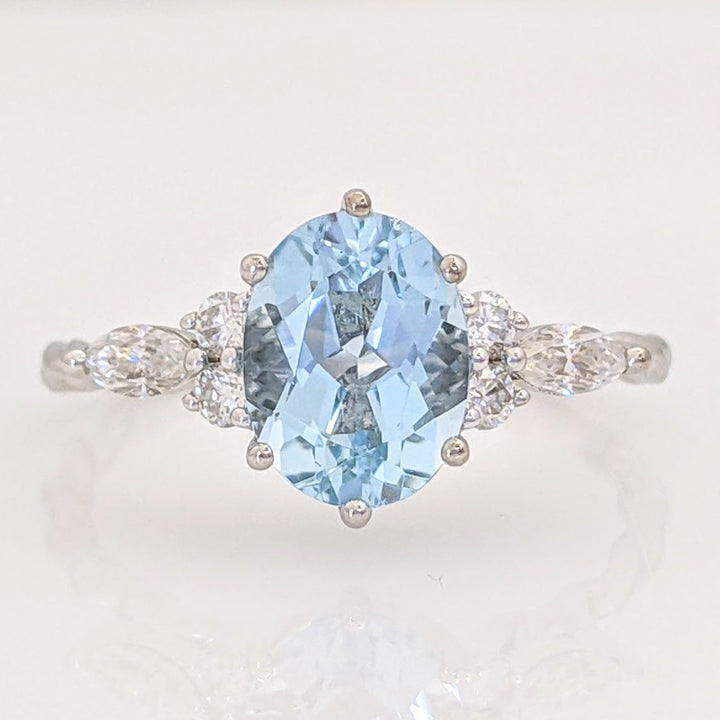 14K WHITE AQUAMARINE OVAL 6X9 WITH .24 DIAMOND TOTAL WEIGHT MARQUISE (2) ROUND (4) ESTATE RING 2.0 GRAMS