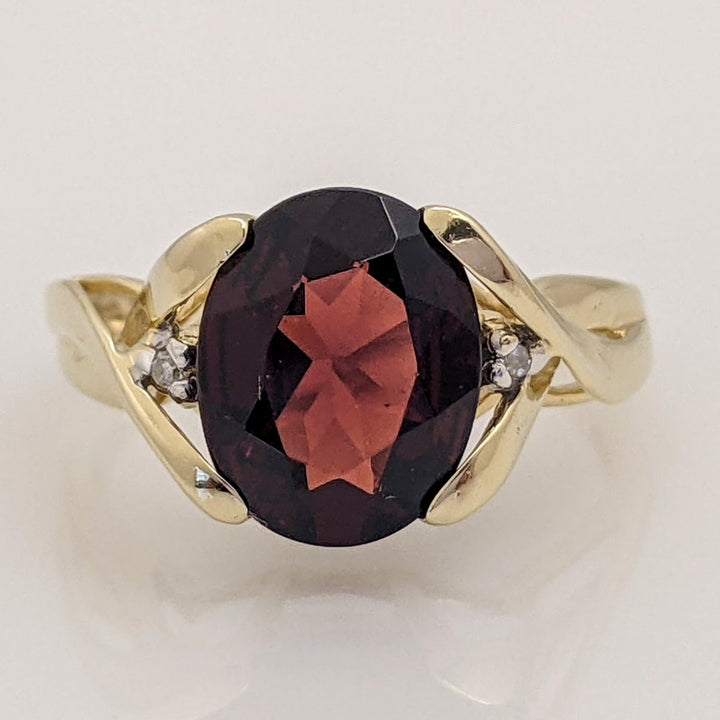 14K GARNET OVAL 8X10 WITH (2) MELEE ESTATE RING 2.6 GRAMS