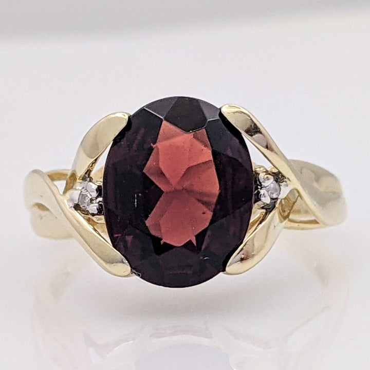 14K GARNET OVAL 8X10 WITH (2) MELEE ESTATE RING 2.6 GRAMS