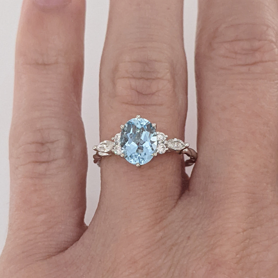 14K WHITE AQUAMARINE OVAL 6X9 WITH .24 DIAMOND TOTAL WEIGHT MARQUISE (2) ROUND (4) ESTATE RING 2.0 GRAMS