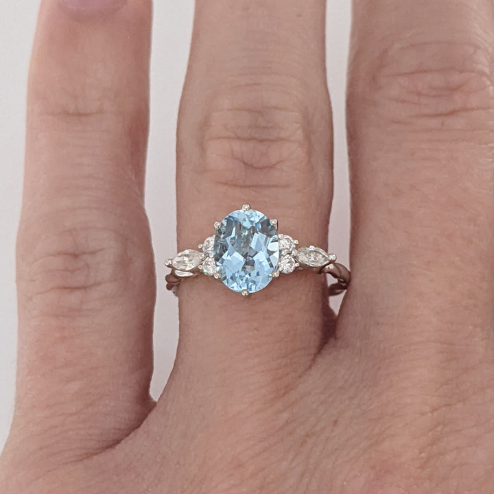 14K WHITE AQUAMARINE OVAL 6X9 WITH .24 DIAMOND TOTAL WEIGHT MARQUISE (2) ROUND (4) ESTATE RING 2.0 GRAMS