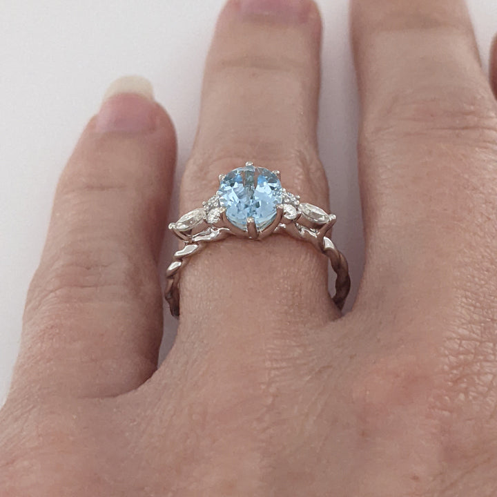 14K WHITE AQUAMARINE OVAL 6X9 WITH .24 DIAMOND TOTAL WEIGHT MARQUISE (2) ROUND (4) ESTATE RING 2.0 GRAMS
