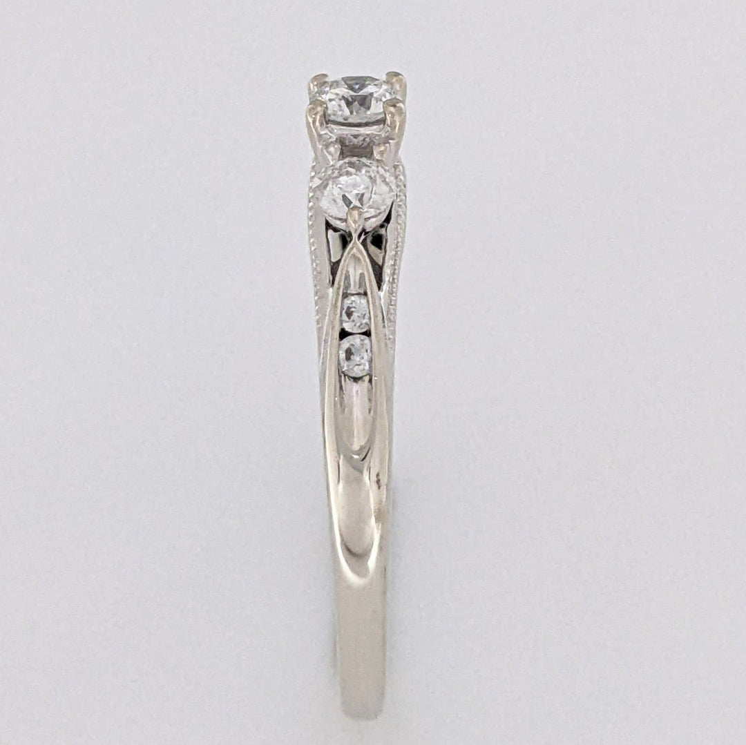 10K WHITE .32 CARAT TOTAL WEIGHT I1 H DIAMOND ROUND (7) ESTATE TRINITY RING 2.0 GRAMS