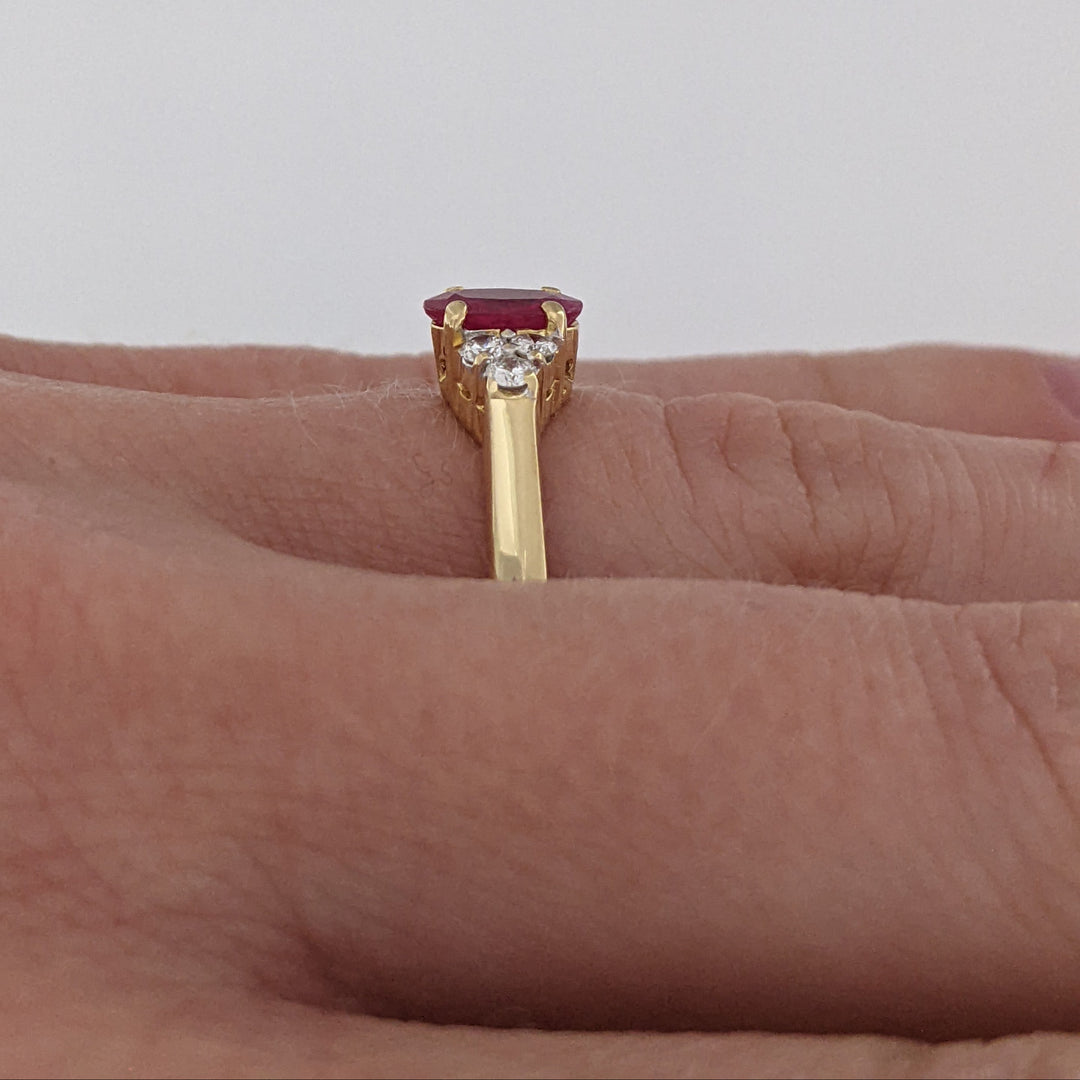 18K RUBY OVAL 4.9X6.6 OVAL WITH .18 DIAMOND TOTAL WEIGHT (6) ROUND ESTATE RING 3.4 GRAMS