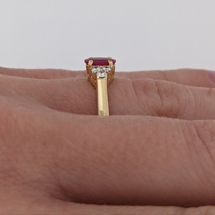 18K RUBY OVAL 4.9X6.6 OVAL WITH .18 DIAMOND TOTAL WEIGHT (6) ROUND ESTATE RING 3.4 GRAMS