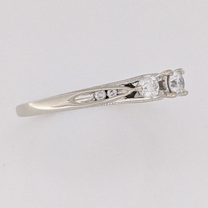 10K WHITE .32 CARAT TOTAL WEIGHT I1 H DIAMOND ROUND (7) ESTATE TRINITY RING 2.0 GRAMS